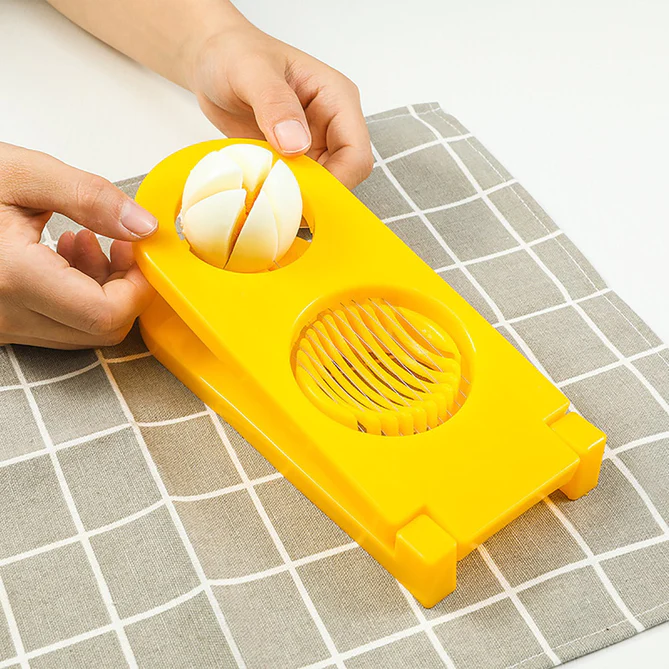 2006_2in1_plalstic_egg_slicer 2 in 1 Double Cut Boiled Egg cutter with stainless steel wire for easy slicing of boiled eggs.